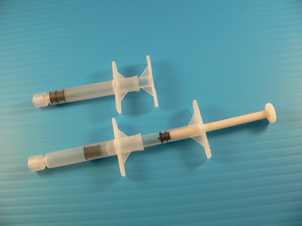 VacuumOperated Auto Retractable Safety Syringe that retract the used